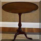 F18. Mahogany pedestal side table with rotating tilt top. 30”h x 26”w - $275